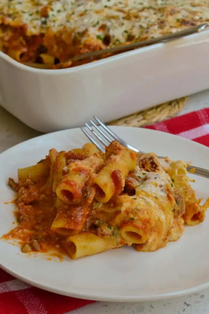 This Baked Ziti pasta casserole is loaded with Italian Sausage, marinara, ricotta, mozzarella and Parmesan cheese and baked to a hot luscious gooey delight.  Serve with a simple garden salad and crusty French bread.