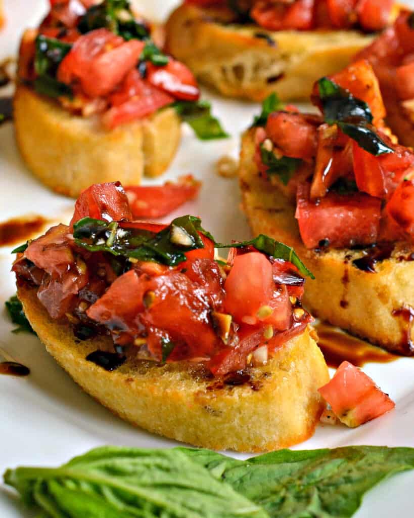 Sun ripened tomatoes, fresh garden basil, and sweet garlic combine to bring you summer's best in this easy Bruschetta recipe with a flavorful balsamic glaze. 