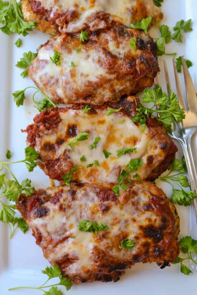 Easy Chicken Parmesan is a scrumptious Italian cheesy chicken recipe that can be on the table in about thirty minutes. 