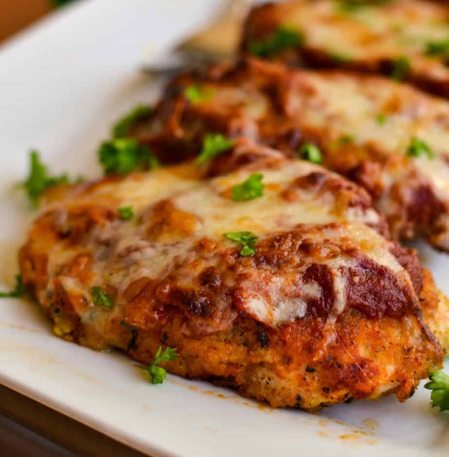 This family friendly Chicken Parmesan is made in one easy ovenproof skillet and comes together in under thirty minutes.