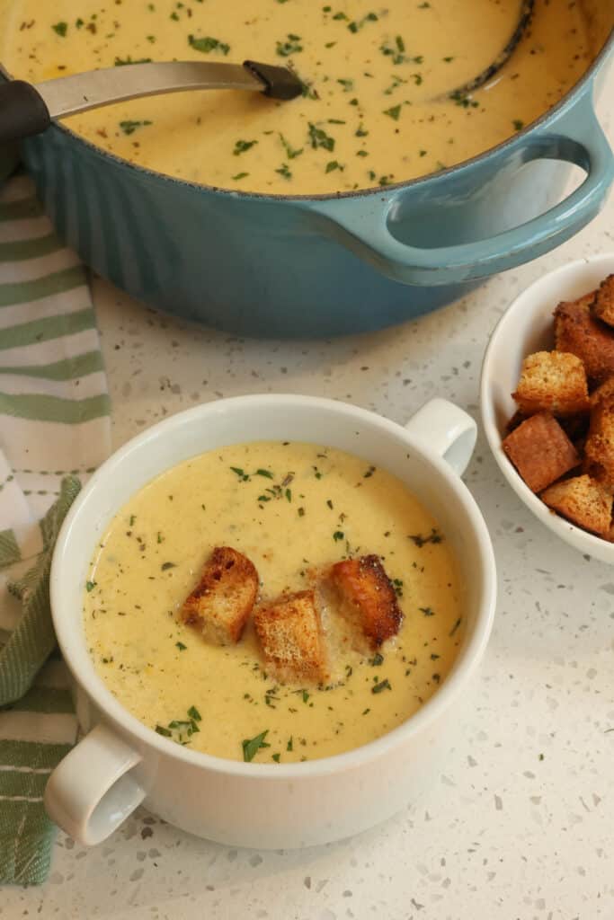 Creamy Celery Soup never tasted so good with onions, garlic, fresh parsley, thyme, and rosemary.  Make a big pot today and top it with home made croutons.