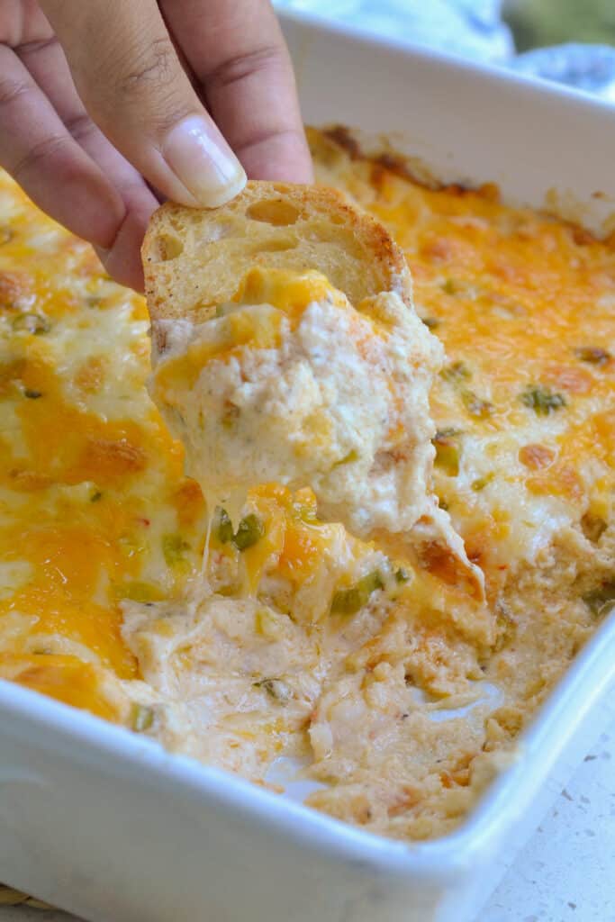 The best ultimate hot Crab Dip made with three different creamy cheeses and a touch of heat and spice. 