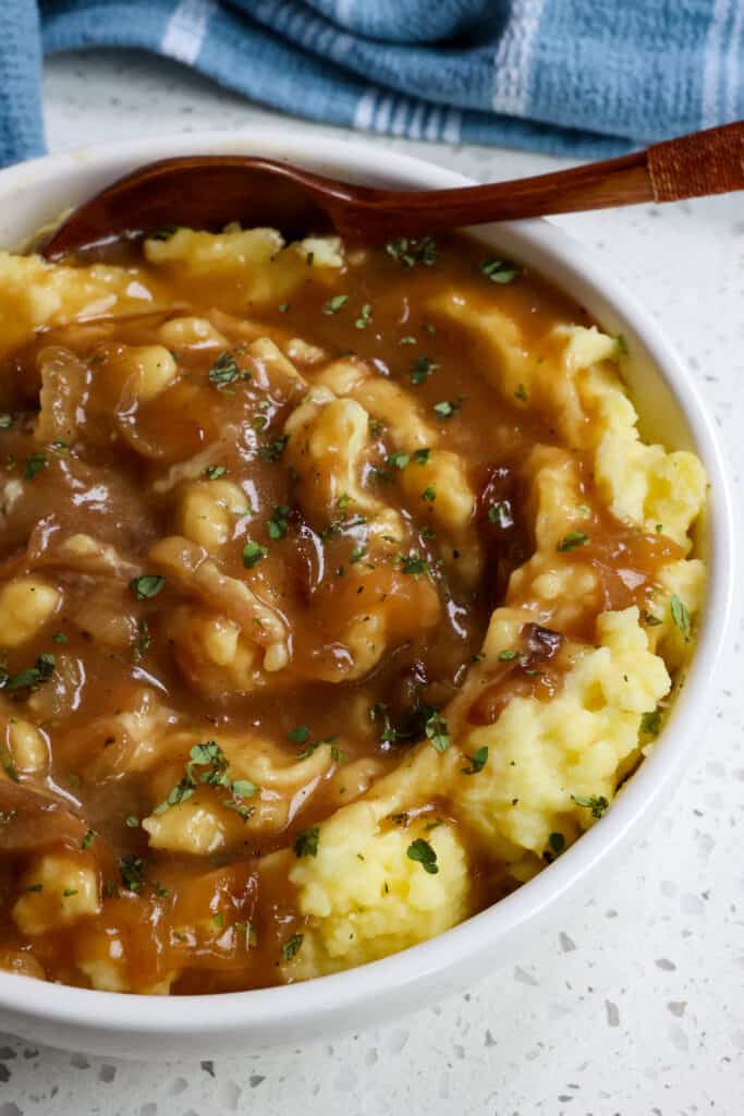 A simple yet delicious caramelized Onion Gravy made with 9 simple ingredients.  Enjoy it with bangers and mash, chicken fried chicken, pork schnitzel, hamburger steak, and so much more, 