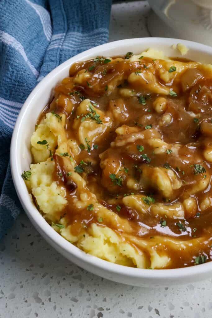 A deliciously easy Onion gravy made with slow cooked sweet caramelized onions, a touch of mustard, and fresh thyme. 