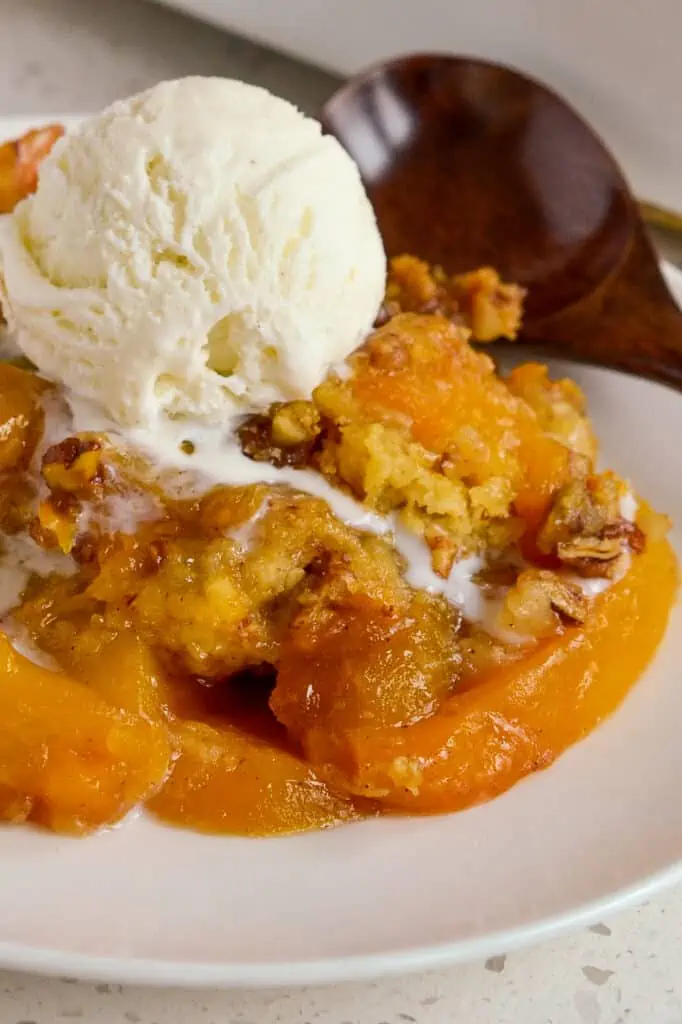Peach crisp is lightly sweetened sliced sun-ripened peaches topped with a buttery cinnamon crumble oatmeal topping. 