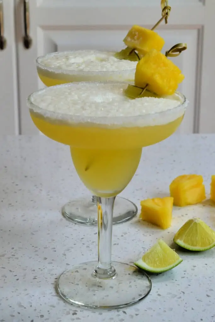 Pineapple Margaritas are one of our favorite entertaining cocktails and perfect for the summer. 