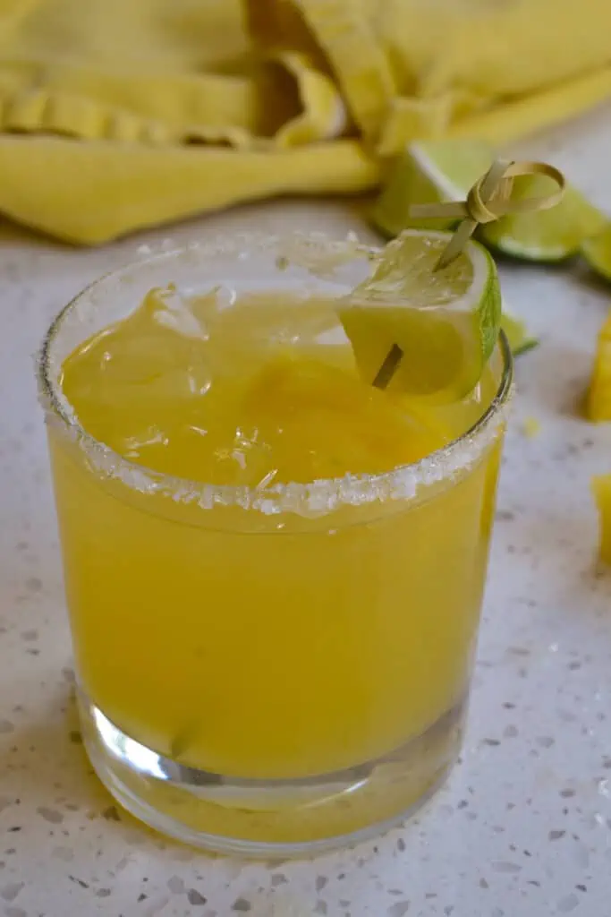 An easy party worthy pineapple cocktail that is made in less than five minute in a blender or two minutes in a glass.
