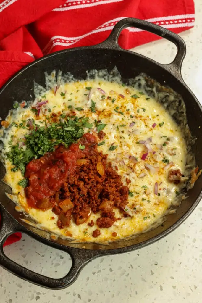 Queso Funddido is a cinch to make and can be prepped in advance of your celebration.
