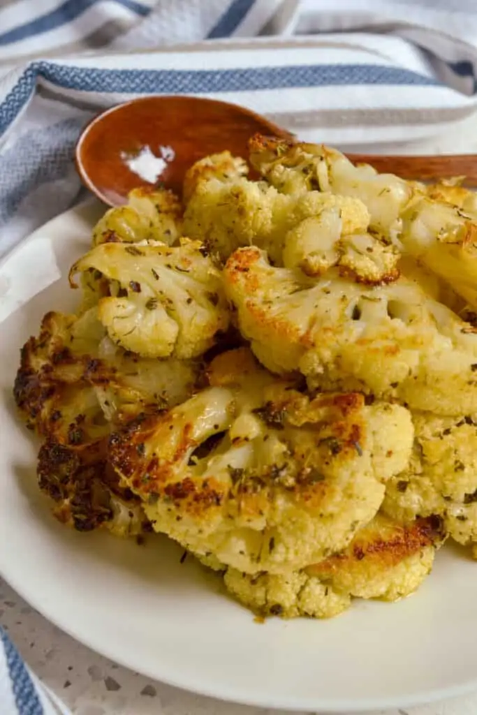 Delicious Roasted Cauliflower is made easy with olive oil, Parmesan cheese and a handful of spices that you may already have in your pantry. 