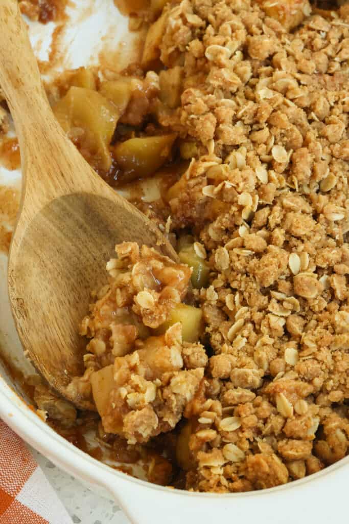A delicious Apple Crumble Recipe with a crisp cinnamon and brown sugar oatmeal topping over fresh baked Granny Smith apples and their juices.