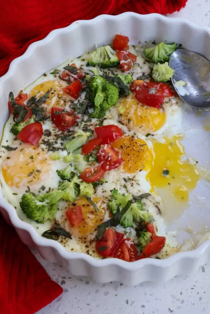 Baked Eggs. with broccoli, tomatoes, fresh herbs, and Parmesan Cheese is easy enough for a weekday breakfast but elegant enough for company. 