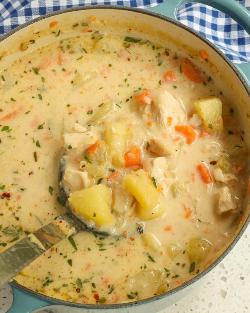 Close up of Chicken Potato Soup in a Dutch oven.