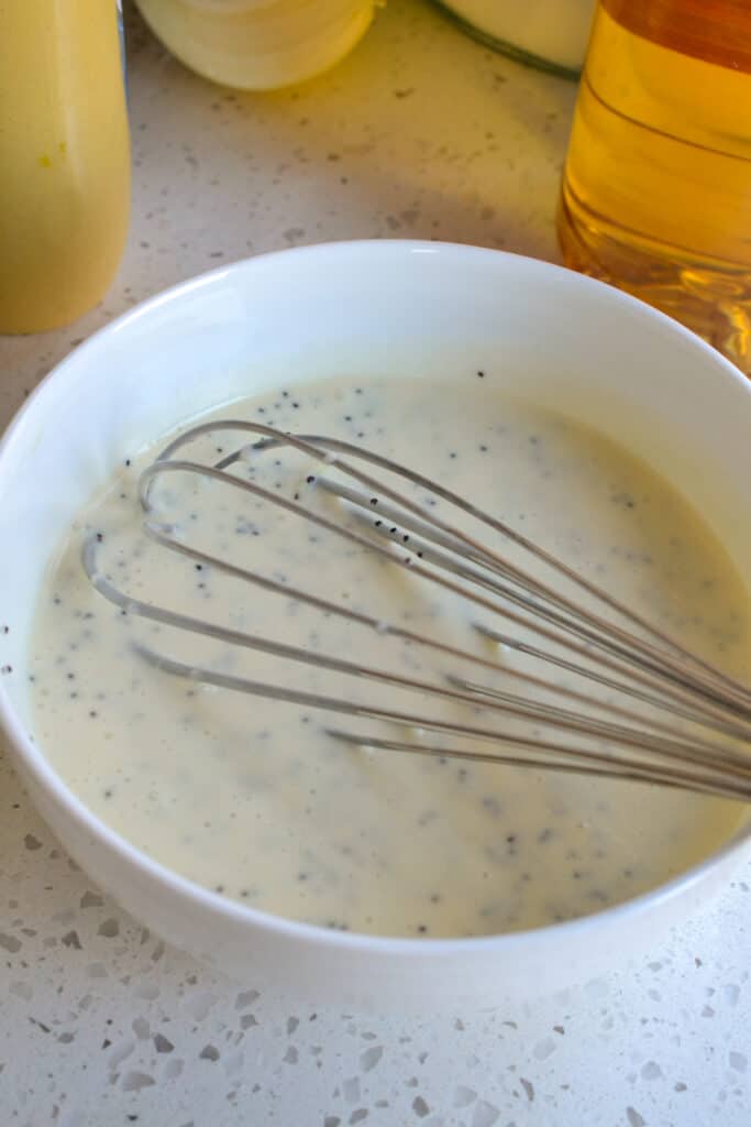 A delectably easy homemade Creamy Poppy Seed Dressing that is so tasty on fresh fruit salad or a spinach salad with pecans or almonds. 