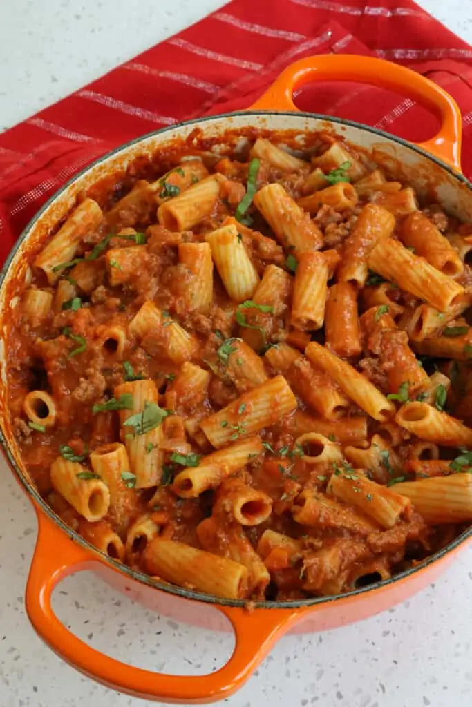 Mix the sauce into the cooked pasta and top with fresh herbs.