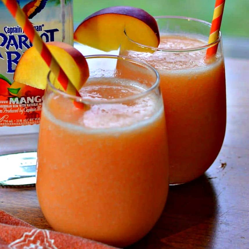 These cool and refreshing perfect Peach Daiquiris are made with four easy ingredients in the blender in less than 5 minutes.