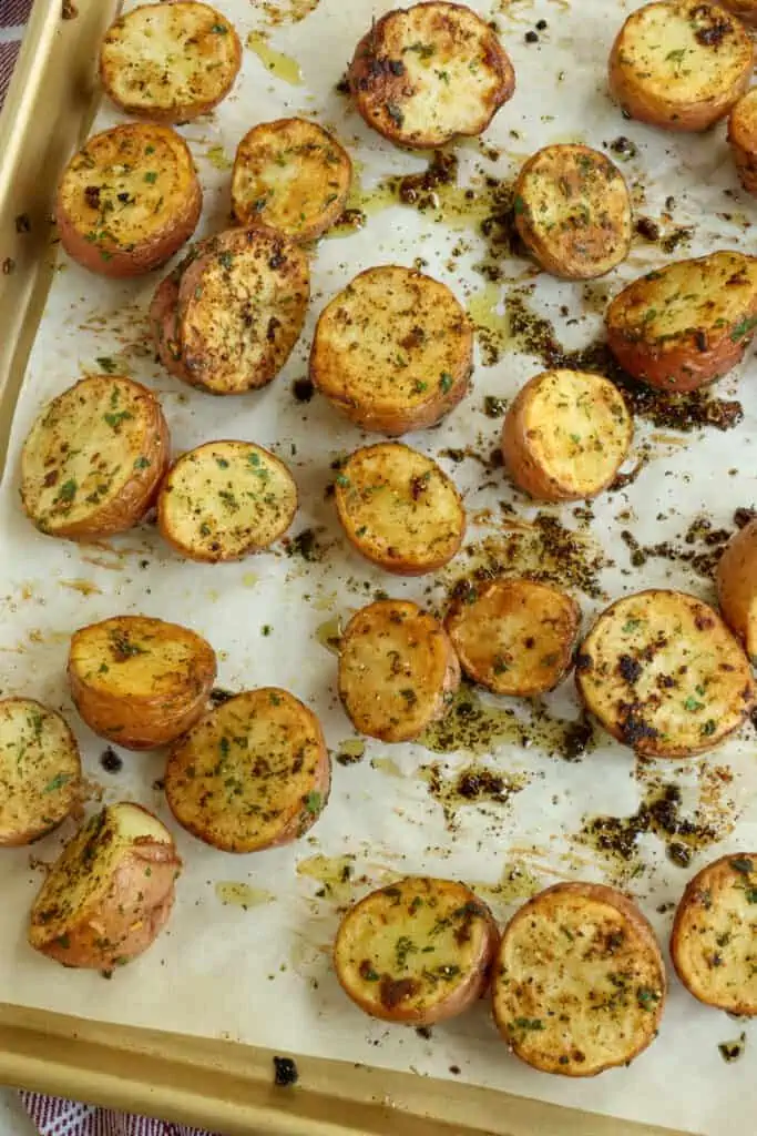 Gently pour them back onto the baking sheet. Turn them cut side up and place them back in the oven for about 10 minutes or until fork tender and golden brown.