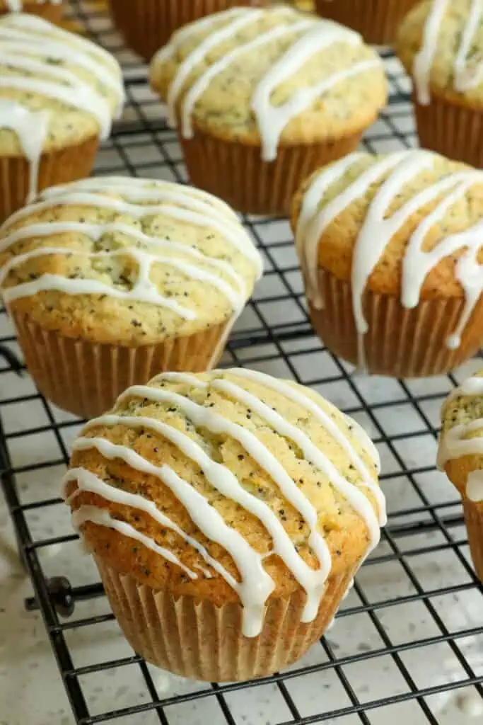 Deliciously moist Lemon Poppy Seed Muffins made with sour cream. lemon zest, lemon juice, and an easy lemon glaze. 