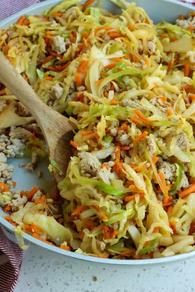 This easy skillet Cabbage Stir Fry is loaded with ground turkey, onions, cabbage, and carrots all drizzled with a six-ingredient salty sweet Asian stir fry sauce. 