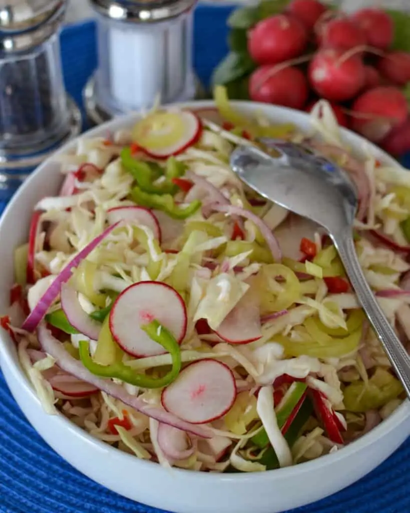This tasty vinegar coleslaw is an easy family friendly recipe ready in fifteen minutes. 