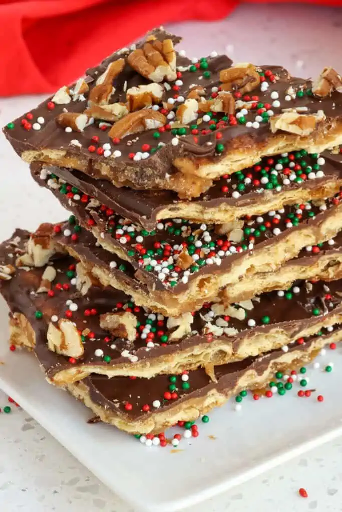 A super easy and delicious sweet and salty Christmas Crack Candy Recipe with layers of crackers, toffee, and chocolate.