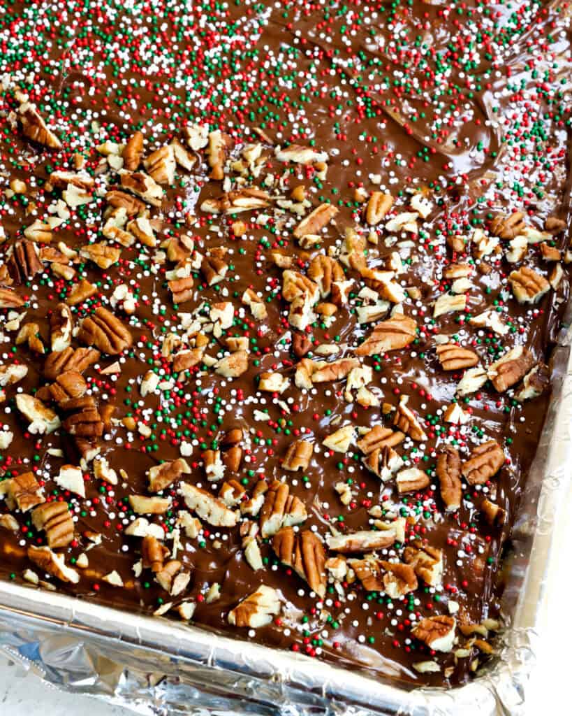 Christmas crack candy in a baking sheet covered with aluminum foil. 