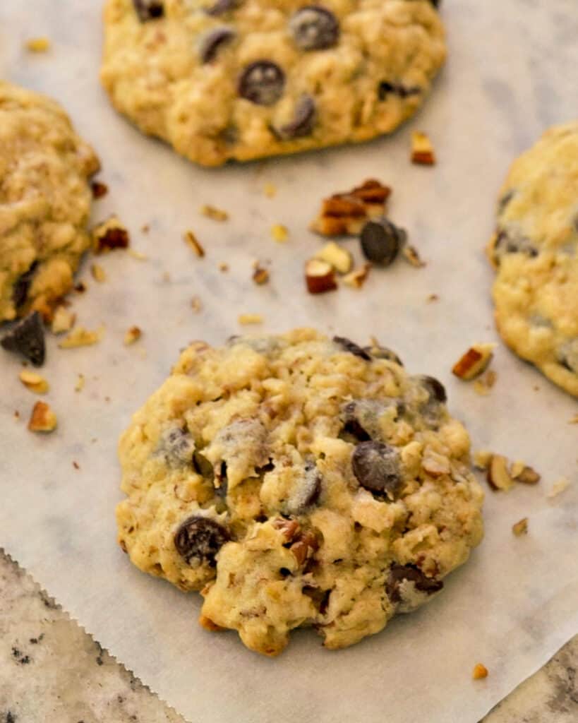 Cowboy Cookies are scrumptious treats filled with chocolate chips, oatmeal, coconut, and chopped pecans.  They are slightly crispy on the outside and soft with just a touch of chewy on the inside.