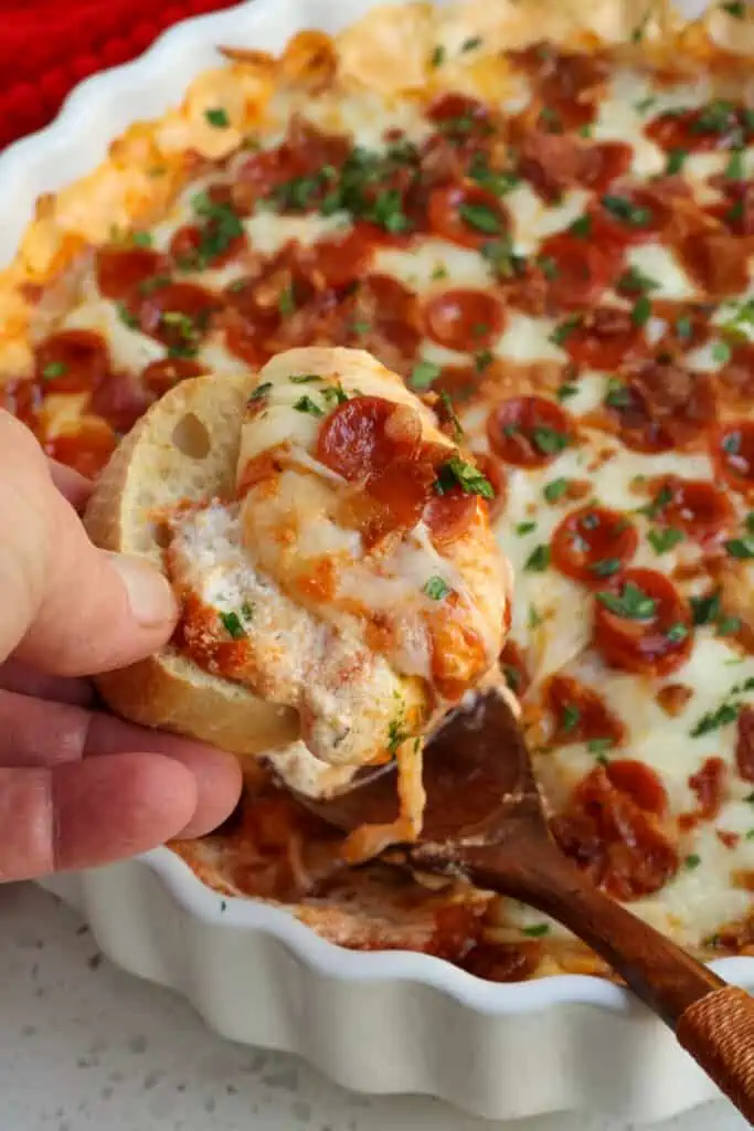 This delicious hot dip is always a hit every time I make it.  Serve with hot rolls, breadsticks, crusty French bread slices, bagel chips, or mini bell peppers. 