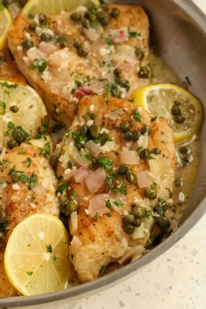 A quick and easy Chicken Piccata Recipe combines golden brown chicken breasts with shallots, garlic, capers, and Italian parsley with a refreshing lemon wine butter sauce.