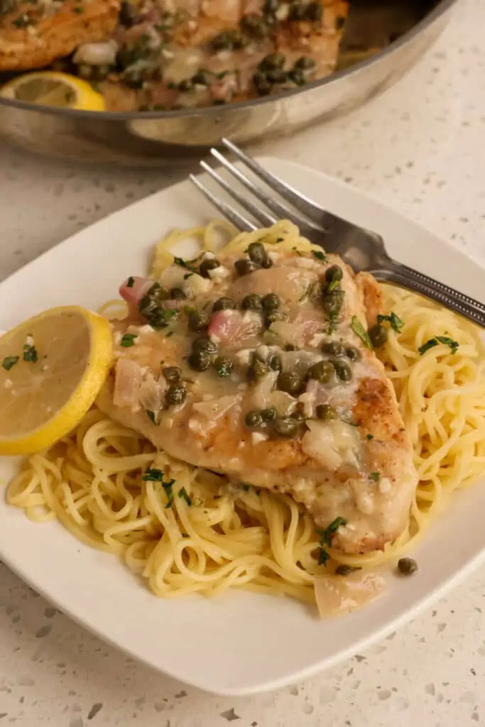 Chicken Piccata is one of my favorite dishes, and I love to serve it over angel hair pasta with a sprinkle of freshly grated Parmesan Cheese.