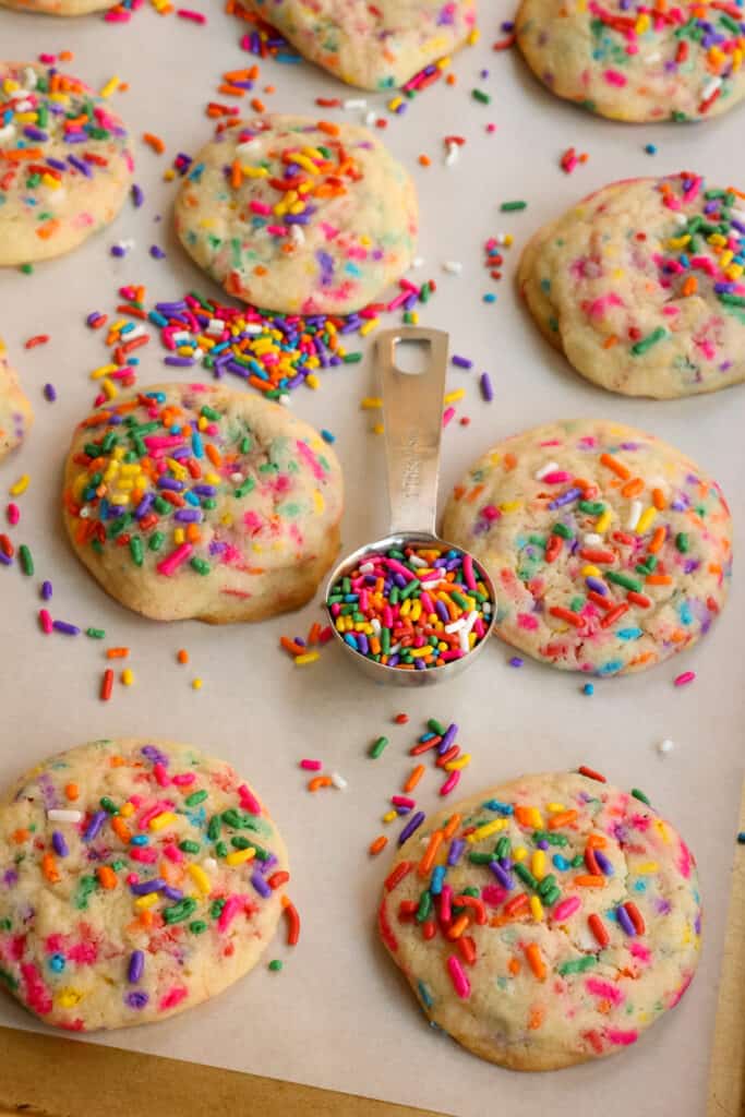 Classic Funfetti Cookies are sugar cookies that are soft and chewy with loads of bright-colored festive sprinkles. 