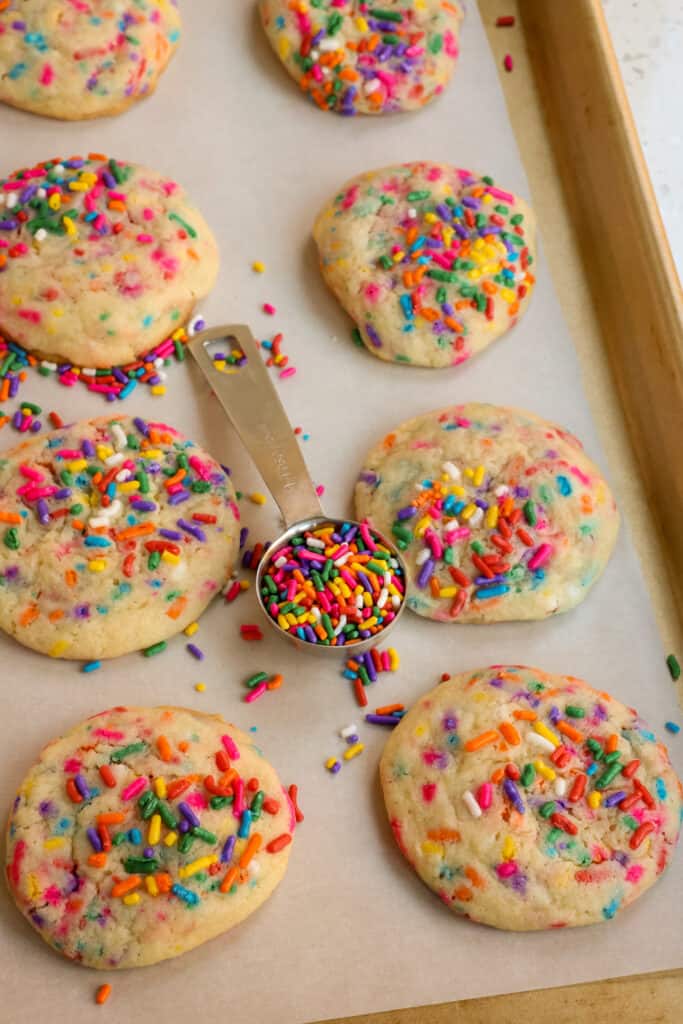 Cover your baking sheets with parchment paper or silicone baking mats.  They help the cookies bake evenly, brown better, and lift off the cookie sheet without breaking.