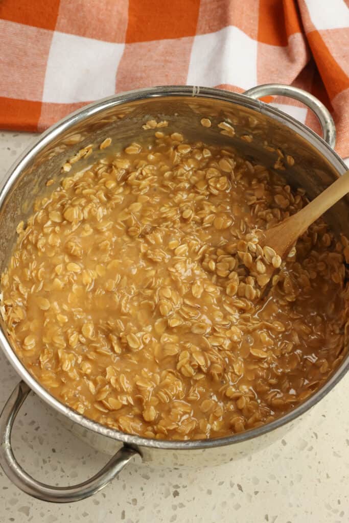 Remove the mixture from the heat and stir in the peanut butter, vanilla, and salt until well combined. Add the oats and stir until mixed in. 