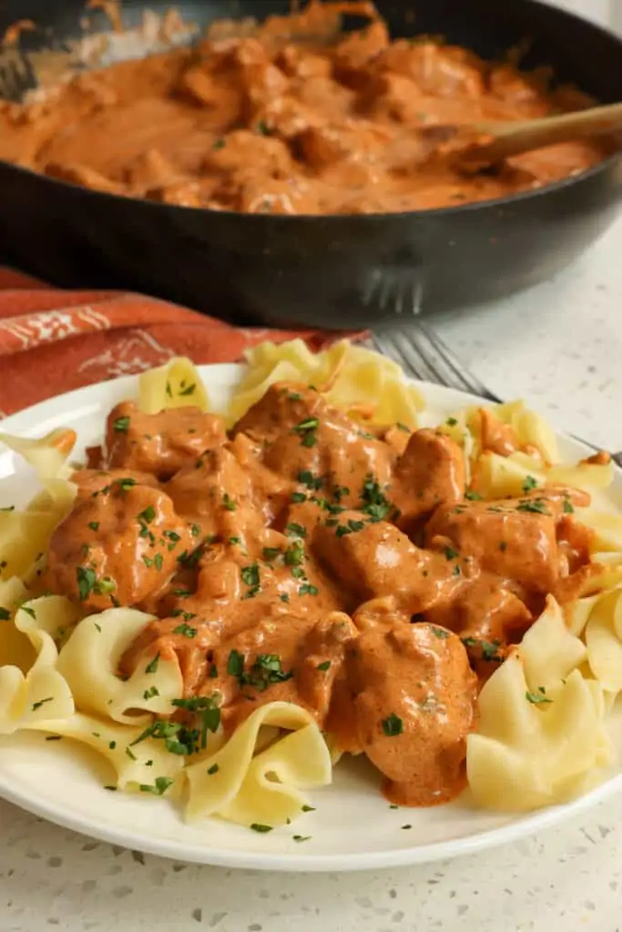 Easy Chicken Paprikash combines bite-sized pieces of chicken breaded and pan-fried in butter all smothered in a creamy sauce seasoned with sweet Hungarian paprika.