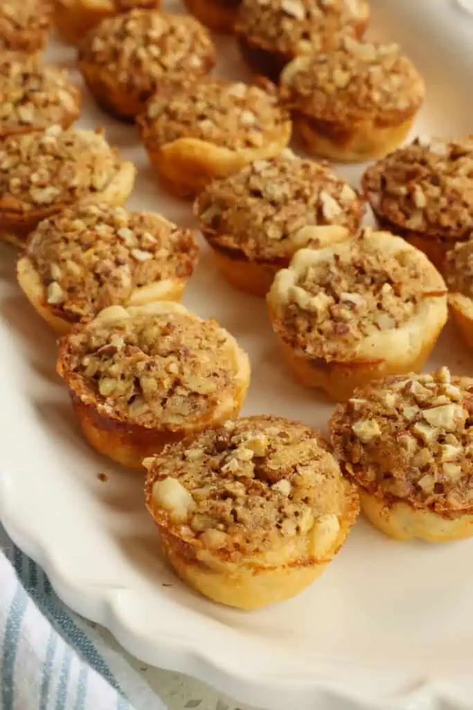 Pecan Tassies are ideal for holiday parties, Christmas baking trays, and gift-giving. 