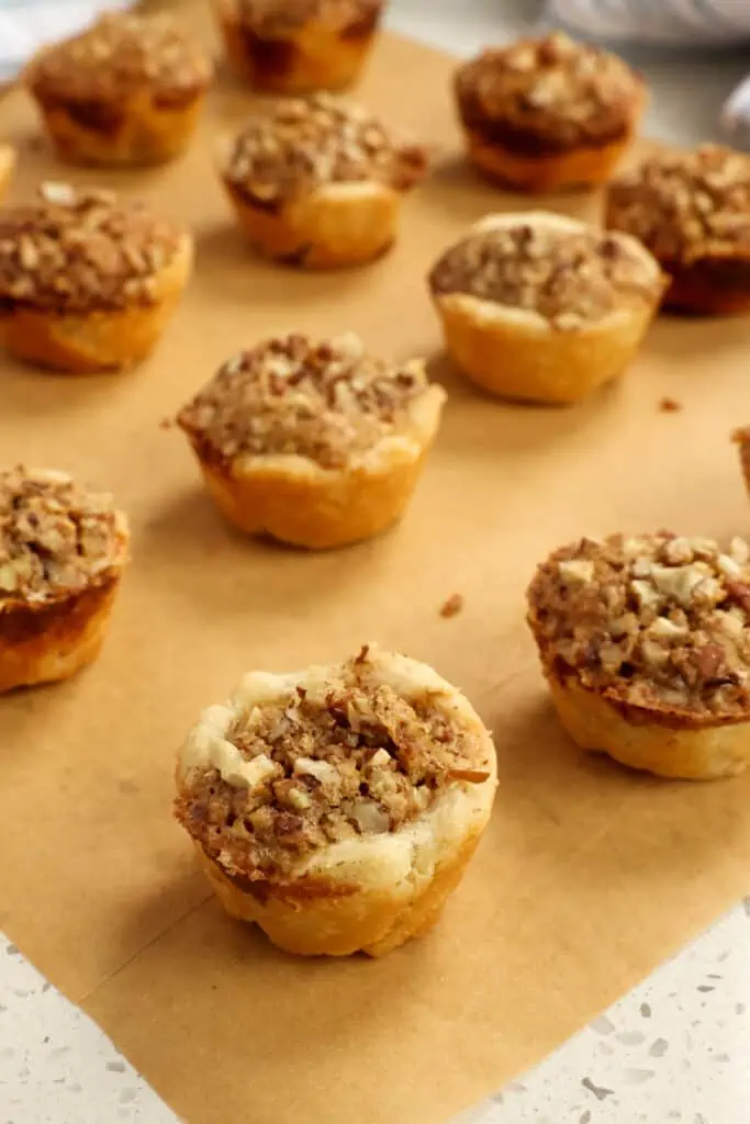 Pecan Tassies, also known as Pecan Tarts, are mini pecan pies with a buttery crust that melts in your mouth.