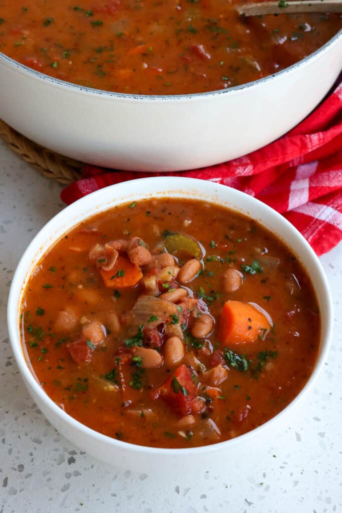 This tasty Pinto Bean Soup combines onions, celery, carrots, fire-roasted tomatoes, and pinto beans in a vegetable broth seasoned with smoked paprika, marjoram, and cumin.
