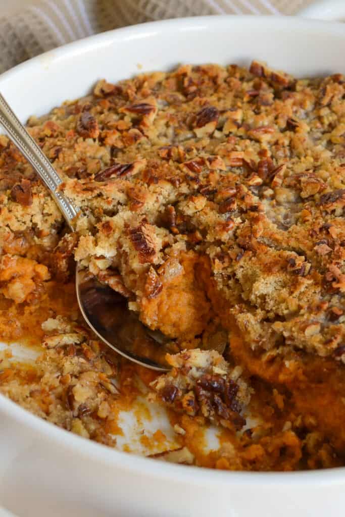 A super easy family-friendly casserole of sweet creamy mashed sweet potatoes topped with a scrumptious crunchy pecan streusel topping. 