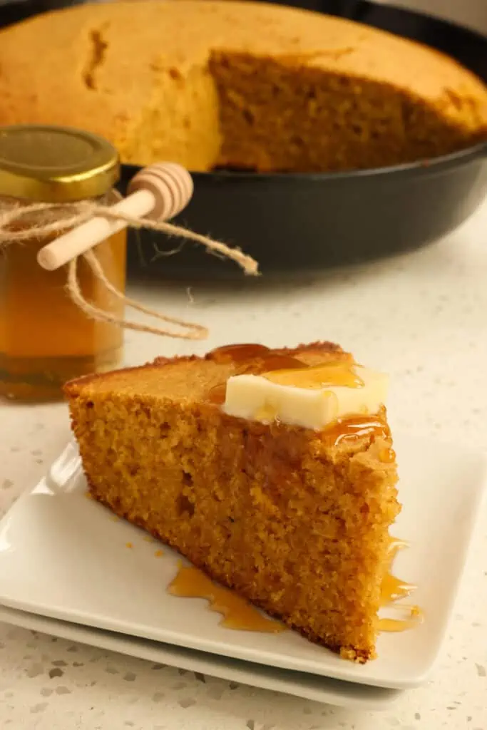 Delicious and easy moist Sweet Potato Cornbread baked with sour cream, butter, cinnnamon, and nutmeg.