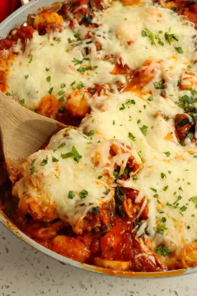 Easy Baked Gnocchi with Italian Sausage, onion, mushrooms, spinach, and mozzarella cheese, all baked up in one ovenproof skillet. 