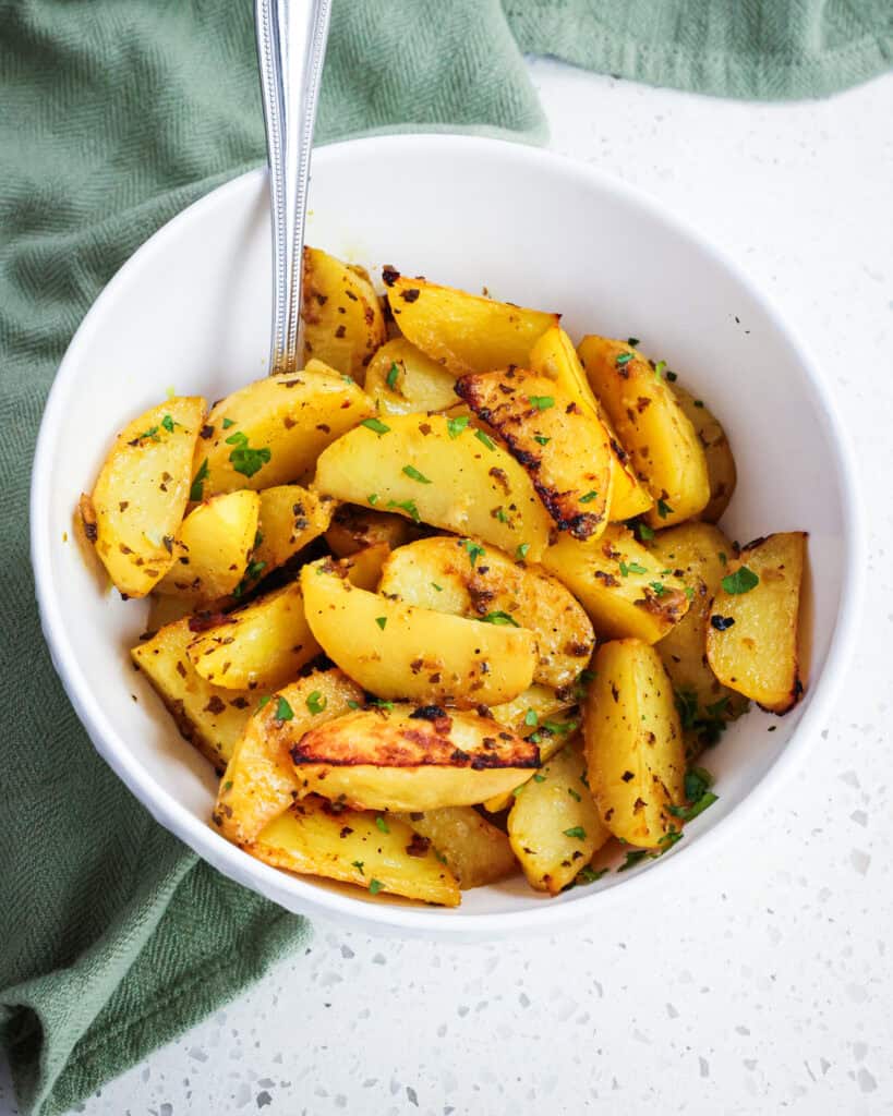 A bowl full of Green Lemon Potatoes. 