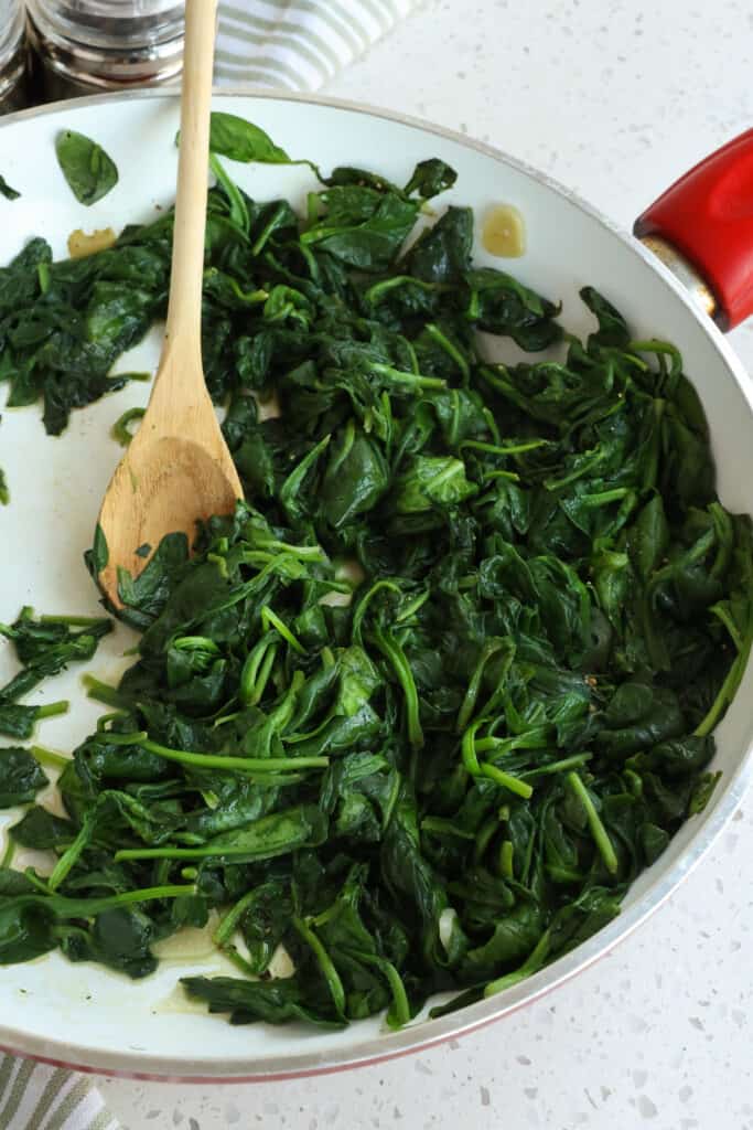 Any raw spinach can be sautéed. I prefer to use baby spinach. It will be delicious and not slimy as long as it is cooked over medium to medium-high heat and cooked just until it is wilted. 