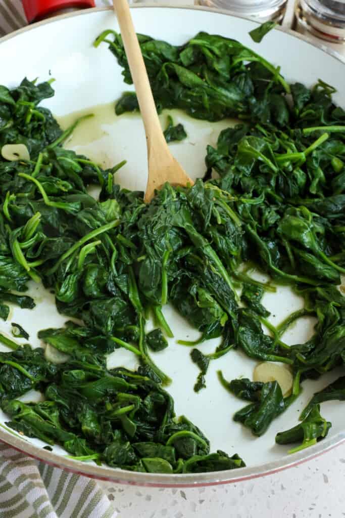 Quick and easy Sautéed Spinach with fresh garlic is made with 5 ingredients in less than 10 minutes, making it an ideal healthy side dish for so many beef, chicken, pork, and seafood entrees. 
