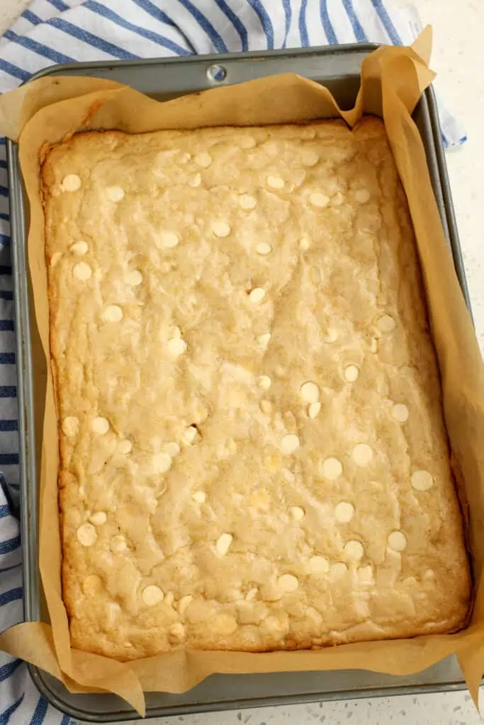 A freshly baked batch of blondies in a metal pan. 
