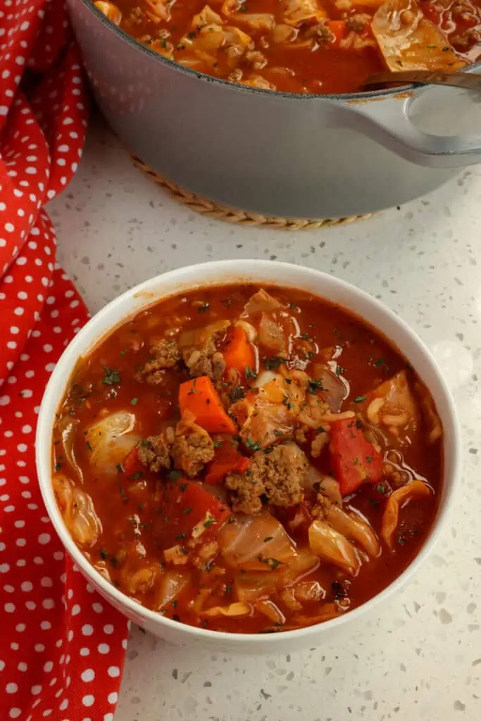 This hearty family friendly soup is flavor packed and full of wholesome ingredients like ground beef, onions, carrots, garlic, tomatoes, and cabbage.