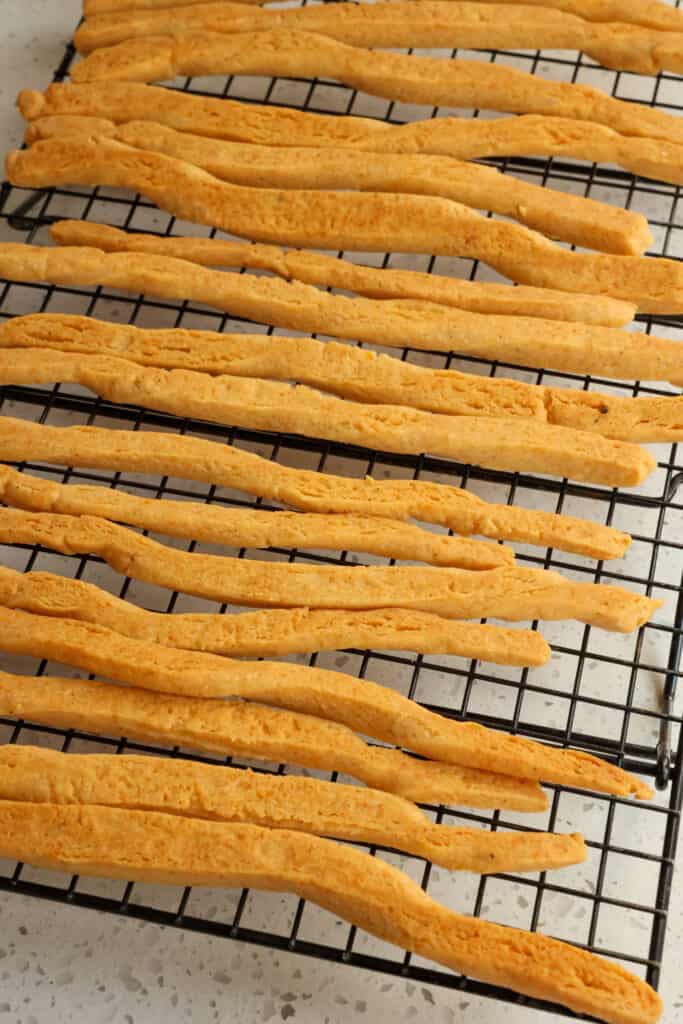Melt in your mouth buttery and super cheesy Cheese Straws made with freshly shredded cheddar cheese, paprika, and cayenne pepper.
