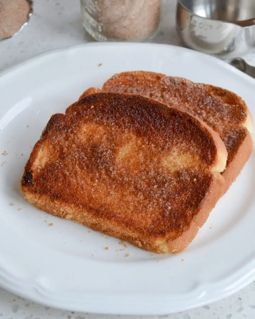 Cinnamon Sugar Toast A serving plate with two pieces of cinnamon toast on it.
