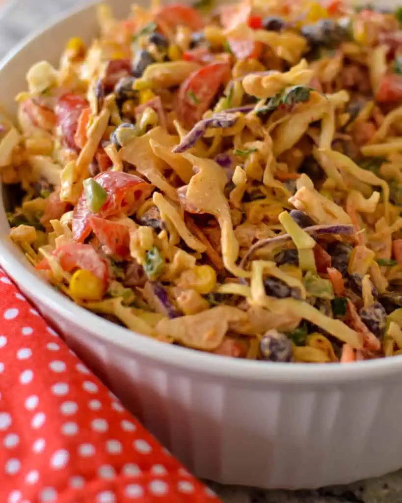 This Easy Mexican Cabbage Slaw can be prepped in about twenty minutes, making it the perfect side dish for picnics, potlucks, summer cookouts, and pool parties.