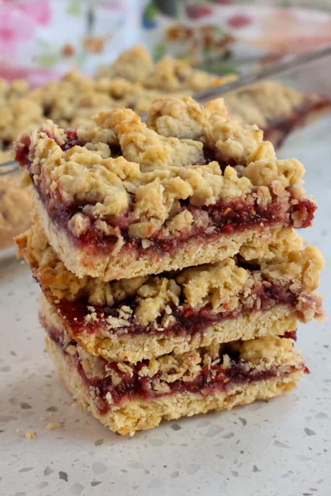 These melt-in-your-mouth Oatmeal Bars with a buttery crumb and a sweet raspberry jam filling are always a huge hit.