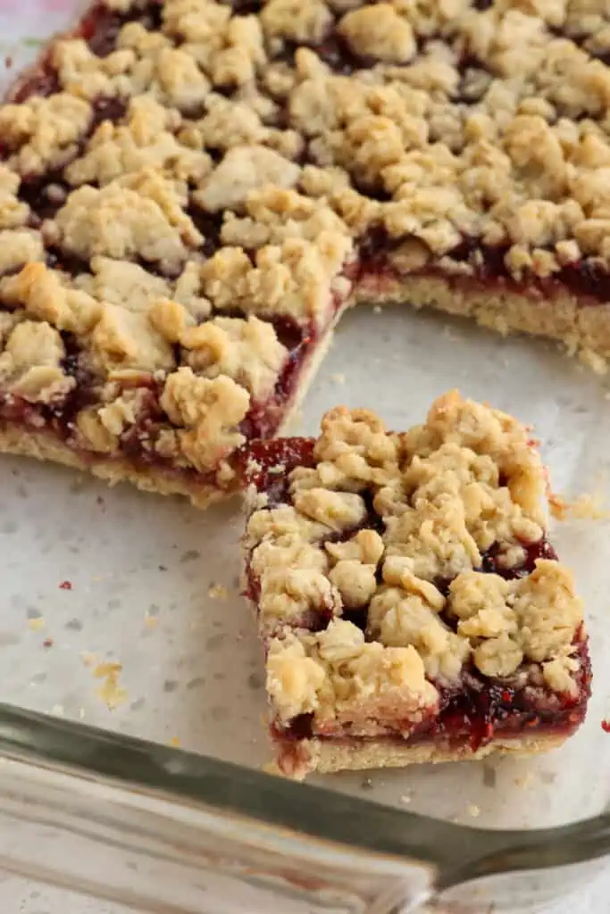 Quick and easy Oatmeal Bars with a soft melt-in-your-mouth crumb that take less than 10 minutes to prep. Customize with your favorite jam filling.  