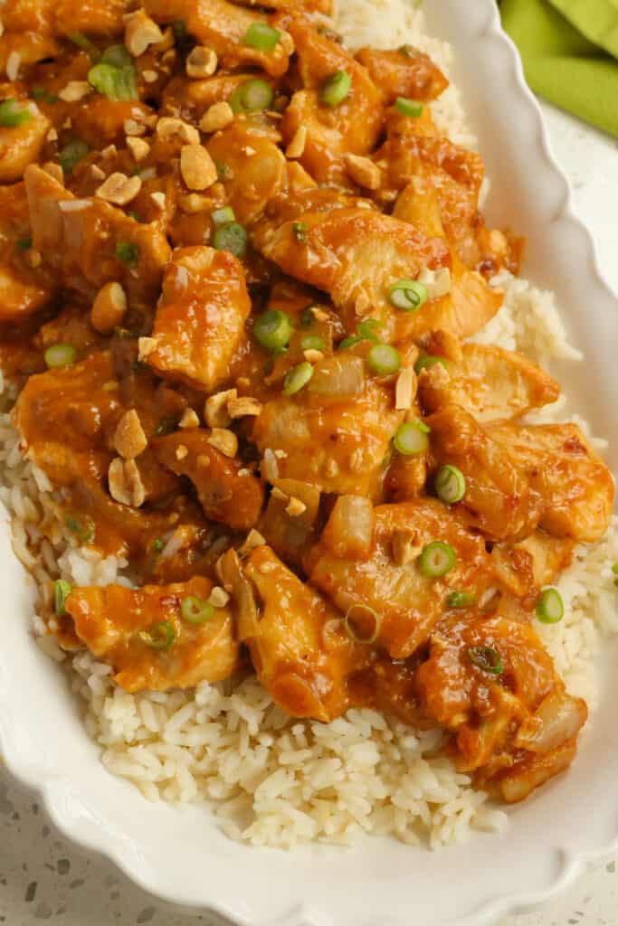 Peanut Butter Chicken is tender pieces of browned chicken breast in a slightly spicy, slightly sweet Asian creamy peanut butter sauce with ginger. 